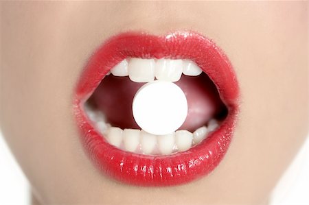 Beauty woman mouth with red lips and medicine pill Stock Photo - Budget Royalty-Free & Subscription, Code: 400-04656431