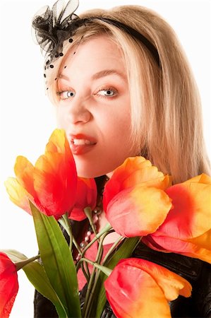 simsearch:400-04227852,k - Pretty toung blonde woman with colorful plastic tulips Stockbilder - Microstock & Abonnement, Bildnummer: 400-04656530