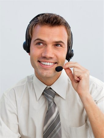 simsearch:400-03990860,k - Portrait of an attractive young businessman working in a call center Photographie de stock - Aubaine LD & Abonnement, Code: 400-04657485