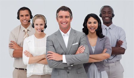 simsearch:400-05155599,k - Smiling confident multi-ethnic team working in a call center Stock Photo - Budget Royalty-Free & Subscription, Code: 400-04657493