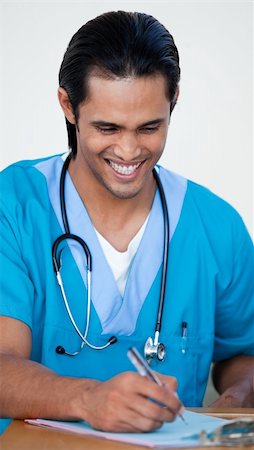 doctor showing results to patient - Young Male Nurse working in a hospital Stock Photo - Budget Royalty-Free & Subscription, Code: 400-04657504