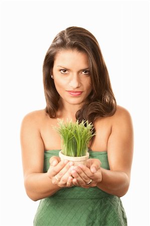 stewardship - Pretty Hispanic Woman with Grass Growing in Pot Stock Photo - Budget Royalty-Free & Subscription, Code: 400-04657653