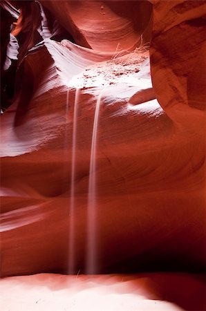 famous desert mountains - Light play with the stream of falling sand from the red rock of the Antelope Canyon Stock Photo - Budget Royalty-Free & Subscription, Code: 400-04657975