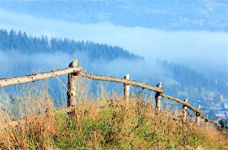 simsearch:400-04306537,k - countryside landscape with wooden fence and mountain behind Stock Photo - Budget Royalty-Free & Subscription, Code: 400-04658189