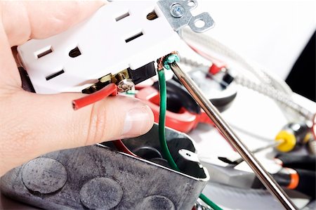 Stock image of Electrician installing a power outlet. Stock Photo - Budget Royalty-Free & Subscription, Code: 400-04658661