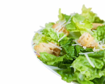 A simple Caesar salad with shallow depth of field.  Clipping path. Stock Photo - Budget Royalty-Free & Subscription, Code: 400-04658673