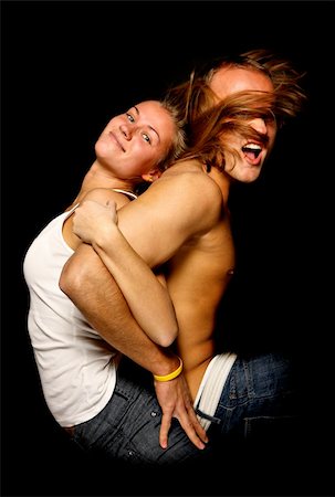 nice young happy couple over black background Stock Photo - Budget Royalty-Free & Subscription, Code: 400-04659003