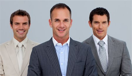 simsearch:400-05118165,k - Portrait of smiling three businessmen with folded arms Foto de stock - Royalty-Free Super Valor e Assinatura, Número: 400-04659649