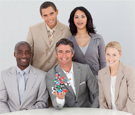 simsearch:400-05155599,k - Multi-ethnic business team holding molecules in the office Stock Photo - Budget Royalty-Free & Subscription, Code: 400-04659712