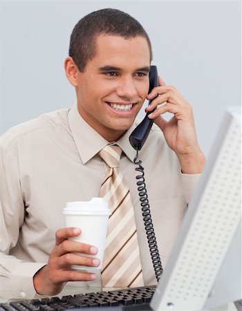 Attractive businessman talking on phone in the office Stock Photo - Budget Royalty-Free & Subscription, Code: 400-04659868