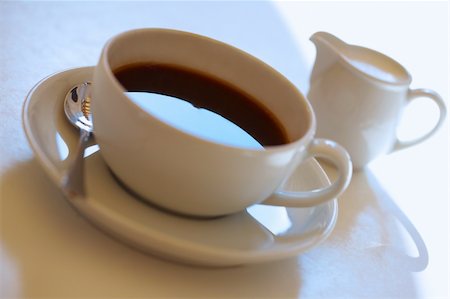 simsearch:400-07477800,k - Espresso coffee cup with steel spoon and with cup of milk Fotografie stock - Microstock e Abbonamento, Codice: 400-04650623