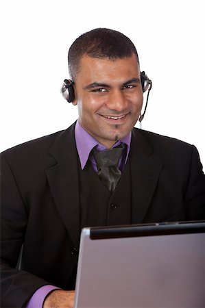 simsearch:400-03985399,k - Closeup of male call center agent expressing positivity. Isolated on white Photographie de stock - Aubaine LD & Abonnement, Code: 400-04650729