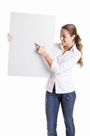 simsearch:400-05368656,k - Portrait of a beautiful woman holding a blank billboard and showing something on it Stockbilder - Microstock & Abonnement, Bildnummer: 400-04650924