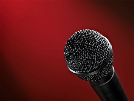 closeup of a microphone against red vignetted  background, may be used for various entertainment or broadcasting themes Stock Photo - Budget Royalty-Free & Subscription, Code: 400-04650976