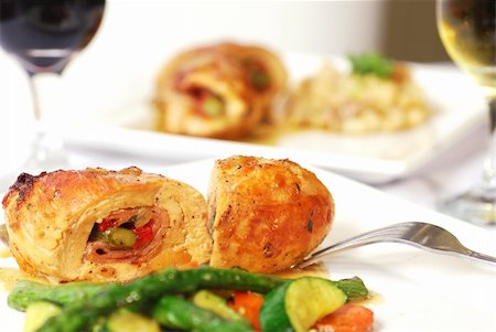 Two dinner plates with stuffed chicken and wine Stock Photo - Budget Royalty-Free & Subscription, Code: 400-04651049