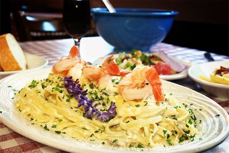 fettucine - Plate of shrimp fettuccine on table at Italian restaurant Stock Photo - Budget Royalty-Free & Subscription, Code: 400-04651080