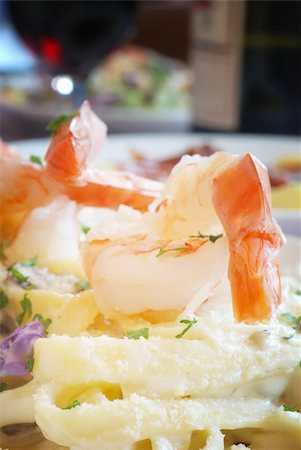 simsearch:400-03992643,k - Shrimp atop a plate of Fettuccini Alfredo in restaurant Stock Photo - Budget Royalty-Free & Subscription, Code: 400-04651082