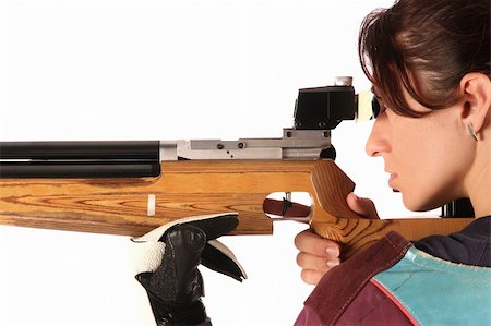 person focusing telescope - beautiful young woman aiming a pneumatic air rifle Stock Photo - Budget Royalty-Free & Subscription, Code: 400-04651112
