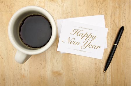 Happy New Year Note Card, Pen and Coffee Cup on Wood Background Stock Photo - Budget Royalty-Free & Subscription, Code: 400-04651788