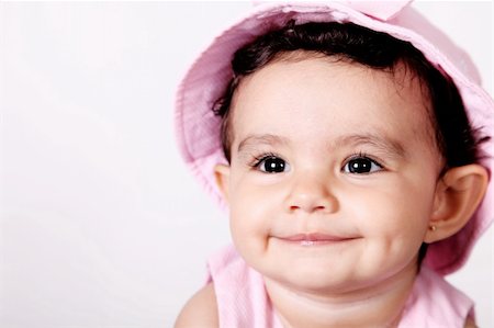 Beautiful baby smiling and looking up. face picture Foto de stock - Royalty-Free Super Valor e Assinatura, Número: 400-04651988