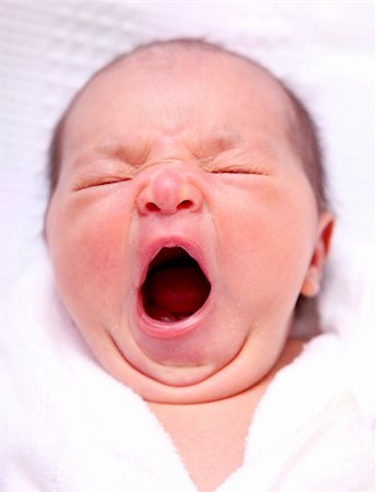 baby to yawn over white background. beauty image Foto de stock - Royalty-Free Super Valor e Assinatura, Número: 400-04652068