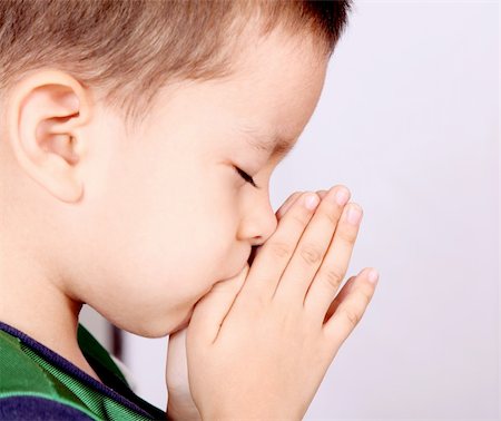 Child pray over white background. Beauty image Stock Photo - Budget Royalty-Free & Subscription, Code: 400-04652072