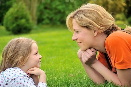 simsearch:400-04795754,k - Young mother and daughter laying on the grass Stock Photo - Budget Royalty-Free & Subscription, Code: 400-04652216