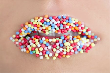 close up of woman lips with multicolored sweet pearls Stock Photo - Budget Royalty-Free & Subscription, Code: 400-04652472