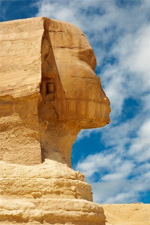 simsearch:400-05369356,k - Side view of the Sphinx with blue skies and clouds in the background Stock Photo - Budget Royalty-Free & Subscription, Code: 400-04652921