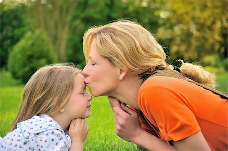 simsearch:400-04795754,k - Mother is kissing her daughter Stock Photo - Budget Royalty-Free & Subscription, Code: 400-04652943