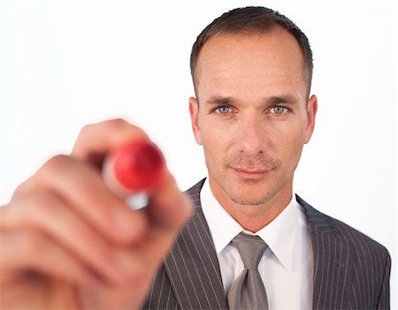 draw close up face - Confident businessman using a red felt-tip pen Stock Photo - Budget Royalty-Free & Subscription, Code: 400-04653012