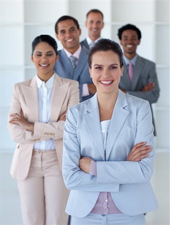 simsearch:400-05155599,k - Businesswoman with her multi-ethnic team smiling at the camera Stock Photo - Budget Royalty-Free & Subscription, Code: 400-04653037