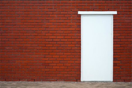 red open house door - White wooden door in a red brick wall, framed to the right Stock Photo - Budget Royalty-Free & Subscription, Code: 400-04653055