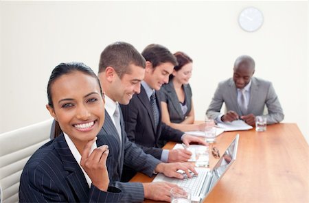 simsearch:400-04187718,k - Indian businesswoman in a meeting smiling at the camera Foto de stock - Royalty-Free Super Valor e Assinatura, Número: 400-04653199