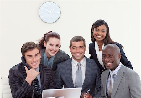 simsearch:400-04187718,k - Multi-ethnic group of people smiling in a business meeting Foto de stock - Royalty-Free Super Valor e Assinatura, Número: 400-04653205