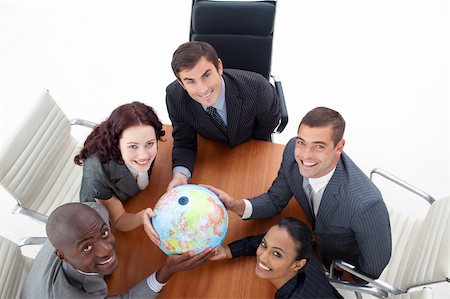simsearch:400-05087119,k - High view of happy business people holding a globe in a meeting. Global business Foto de stock - Royalty-Free Super Valor e Assinatura, Número: 400-04653210