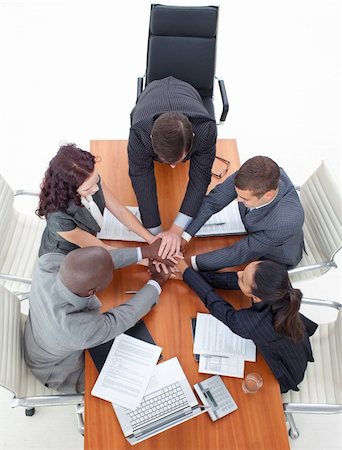 High angle of business team with hands together in a meeting Stock Photo - Budget Royalty-Free & Subscription, Code: 400-04653300