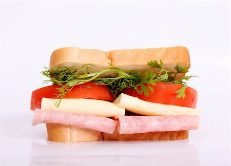 Sandwich with cheese, ham and tomatoes. Food image Foto de stock - Royalty-Free Super Valor e Assinatura, Número: 400-04653301