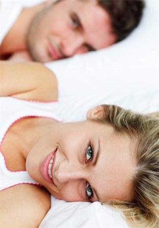 romantic pictures of lovers sleeping - Beautiful smiling woman lying in bed with her attractive boyfriend Stock Photo - Budget Royalty-Free & Subscription, Code: 400-04653329