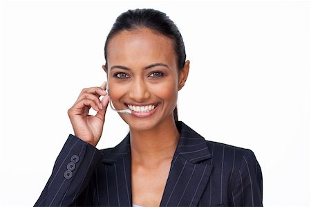 simsearch:400-03990860,k - Portrait of a smiling Indian businesswoman talking on a headset Photographie de stock - Aubaine LD & Abonnement, Code: 400-04653354