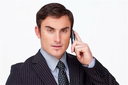 Portrait of a serios young businessman on phone against white Foto de stock - Super Valor sin royalties y Suscripción, Código: 400-04653367