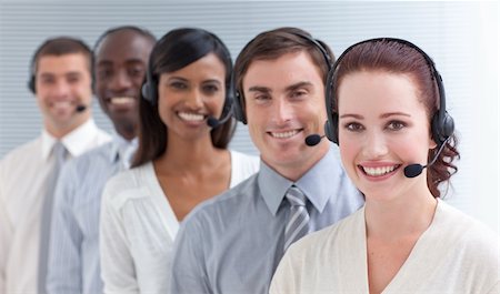 Young attractive business people working in a call center in a line Stock Photo - Budget Royalty-Free & Subscription, Code: 400-04653378