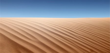 parched - Panoramic view of desert landscape. No one is viewable in the shot. Horizontally framed shot. Stock Photo - Budget Royalty-Free & Subscription, Code: 400-04653441