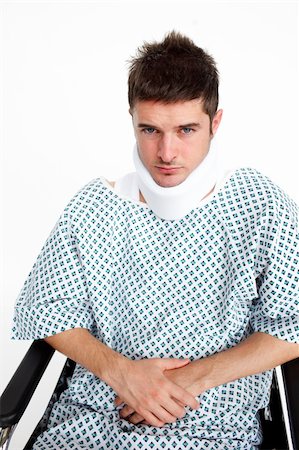 simsearch:400-04422230,k - Man with a neck brace sitting in a wheelchair in hospital Stock Photo - Budget Royalty-Free & Subscription, Code: 400-04653537