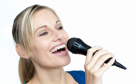 Close-up of beautiful woman singing on a microphone Stock Photo - Budget Royalty-Free & Subscription, Code: 400-04653541