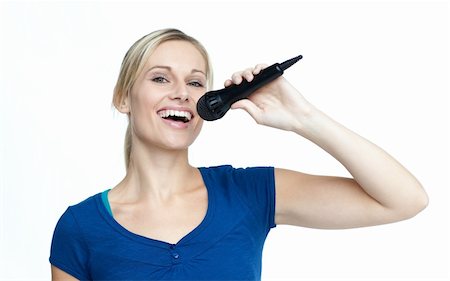 Beautiful happy girl singing on a microphone Stock Photo - Budget Royalty-Free & Subscription, Code: 400-04653542