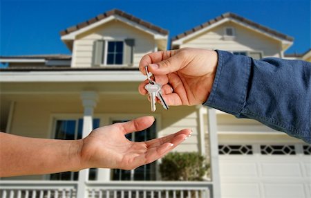 simsearch:400-03938701,k - Handing Over the House Keys in Front of a Beautiful New Home. Stock Photo - Budget Royalty-Free & Subscription, Code: 400-04653866