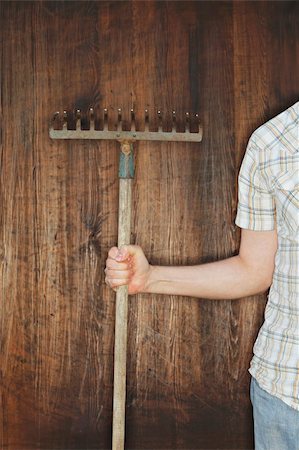 Man holding an old rake Stock Photo - Budget Royalty-Free & Subscription, Code: 400-04664226