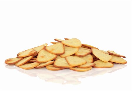 simsearch:400-07993657,k - Potato triangle snacks, isolated over white background with reflection. Photographie de stock - Aubaine LD & Abonnement, Code: 400-04664545