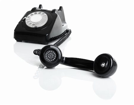 simsearch:400-06700777,k - Nice vintage telephone perfectly isolated on white background, focus is on the handset Foto de stock - Super Valor sin royalties y Suscripción, Código: 400-04665176